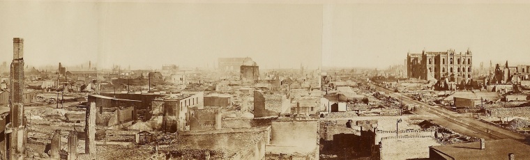 photograph showing panaromic view of burned out buildings and rubble.