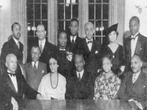 ASNLH 1935 meeting; Woodson is seated on the far left, next to him is CPL librarian, Vivian G. Harsh (Source: George Cleveland Hall Branch Archives, Photo 044, Harsh Research Collection, Chicago Public Library)