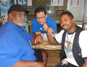 Artists Larry Stroman, Gene Ha, and Elgin Bokari Smith at a past Pocket Con.