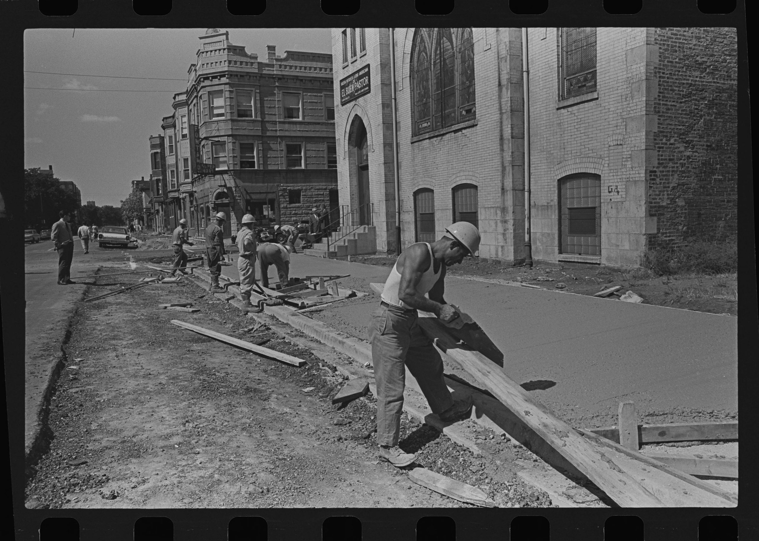 Sidewalk construction, W. Polk Street, undated