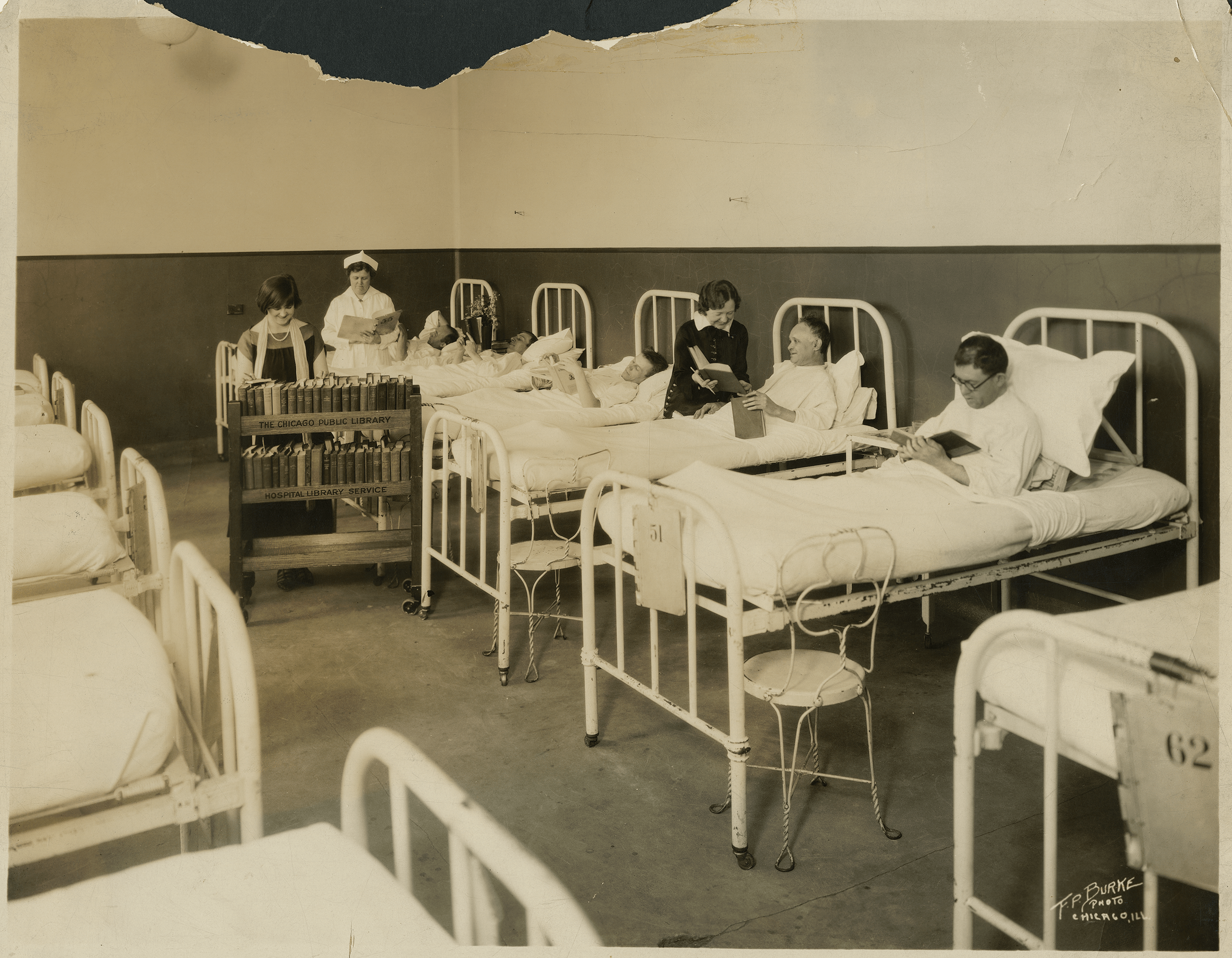 hospital patients reading books in bed