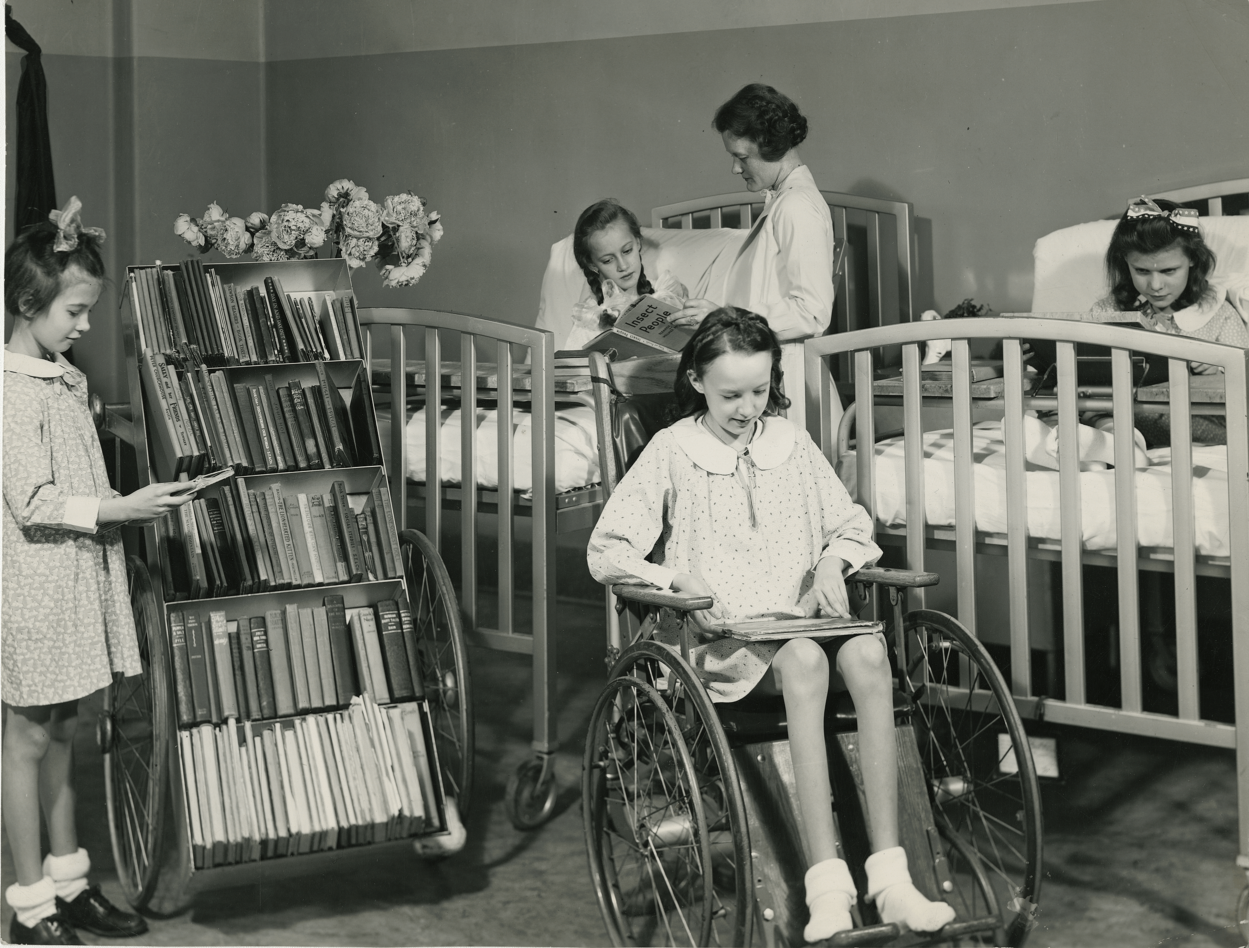 Circa 1940s, hospital patients browsing CPL books.